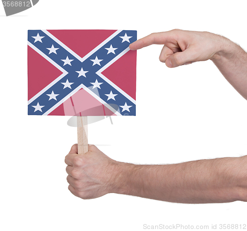 Image of Hand holding small card - Flag of the Confederacy