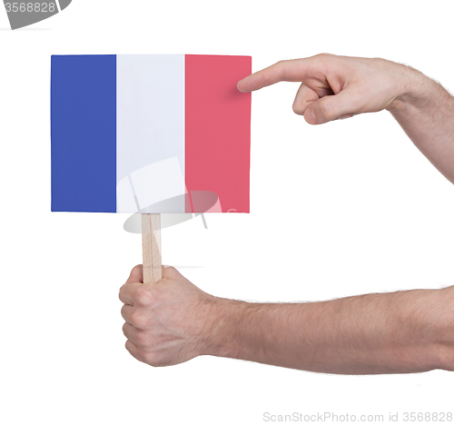 Image of Hand holding small card - Flag of France