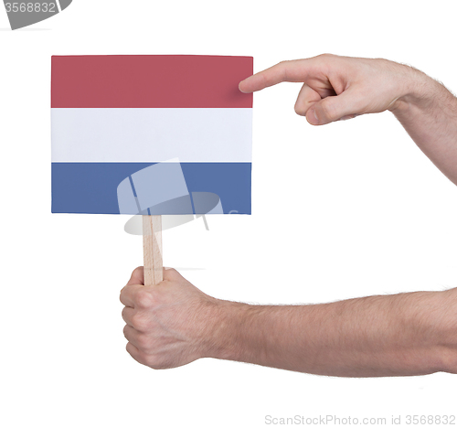 Image of Hand holding small card - Flag of the Netherlands