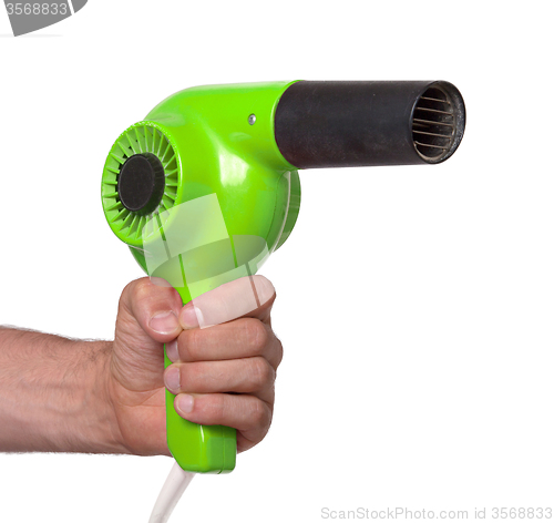 Image of Old green hairdryer in hand