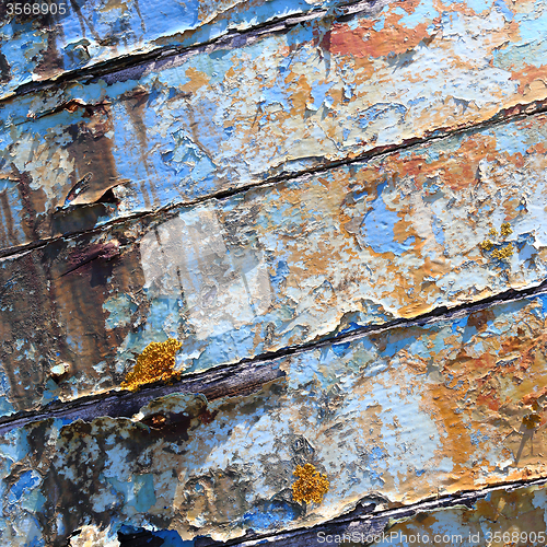 Image of Old boat with peeling paint background texture