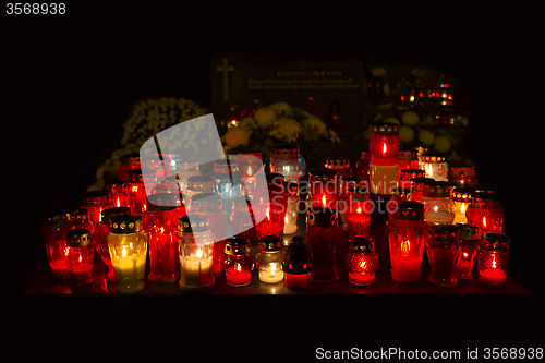 Image of Candles Burning At a Cemetery