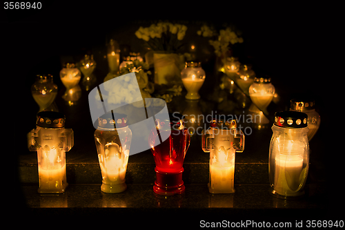 Image of Candles Burning At a Cemetery