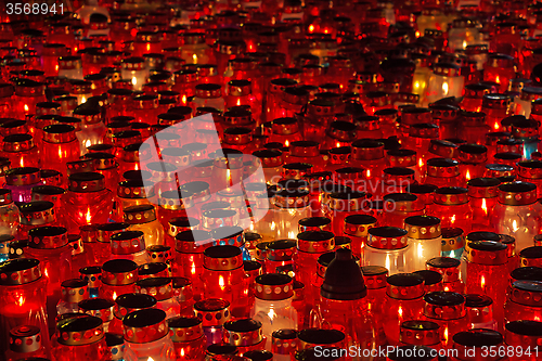 Image of Candles Burning At a Cemetery