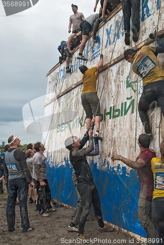 Image of Team storms big wall in extrim race. Tyumen.Russia