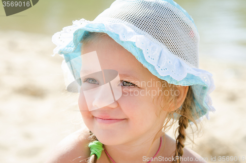 Image of Portrait of a cheerful little girl on the beach in panama
