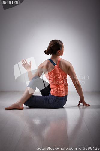 Image of Sporty fit yogini woman practices yoga asana