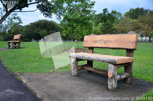 Image of Wood bench in a green garden