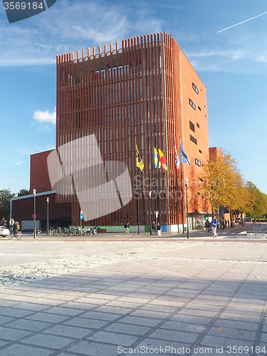 Image of editorial  A modern office building is seen in by an outdoor squ