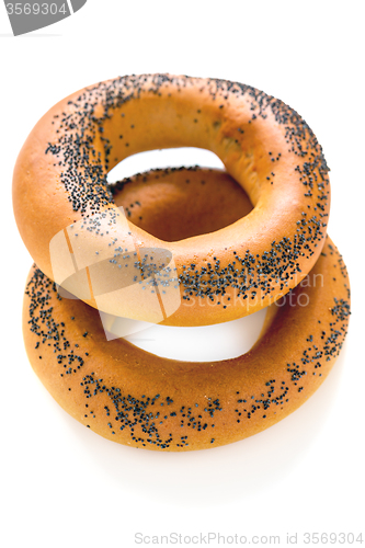 Image of Two bagels with poppy seeds.