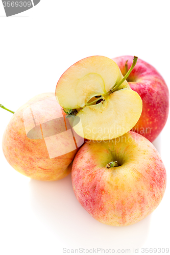 Image of Three whole and half an apple.