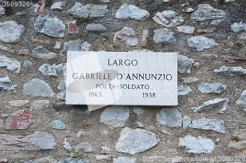 Image of Road sign indicating a street name in Italian "Gabriele D'Annunz