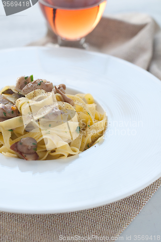 Image of 
Pasta and rice with porcini mushrooms served with butter and pa