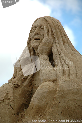 Image of Sad sand woman