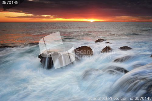 Image of OceanwWaterfalls over rocks