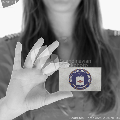 Image of Woman showing a blank business card