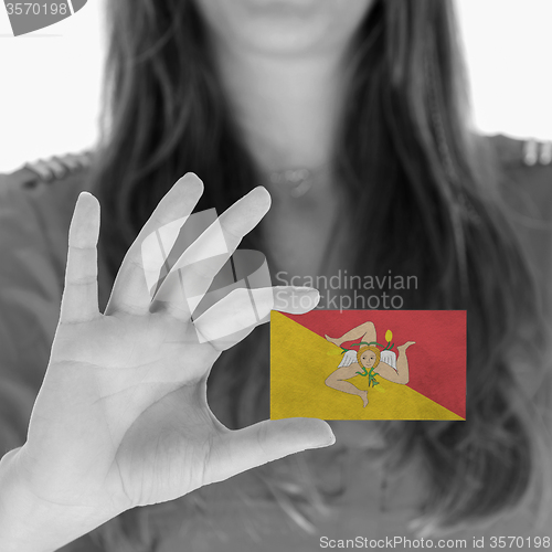 Image of Woman showing a blank business card