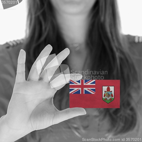 Image of Woman showing a blank business card