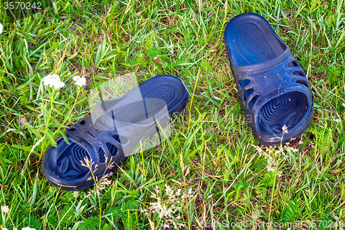 Image of Shoes for beach activities on the river, in the countryside.