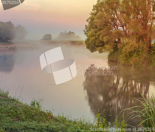 Image of Early foggy morning and a small river.