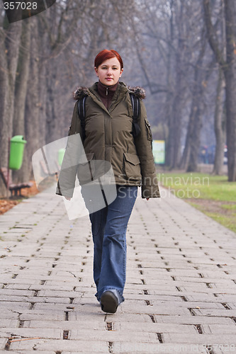 Image of Teenager walking in a park
