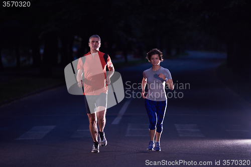 Image of couple jogging at early morning