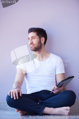 Image of student working on tablet