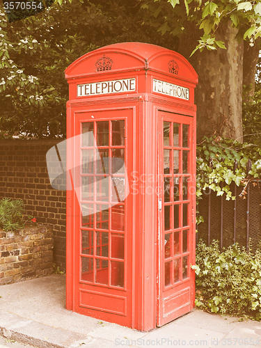 Image of Retro looking Red phone box in London