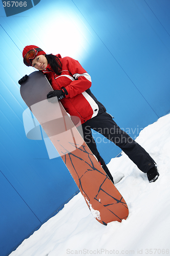 Image of young adult female snowboarder