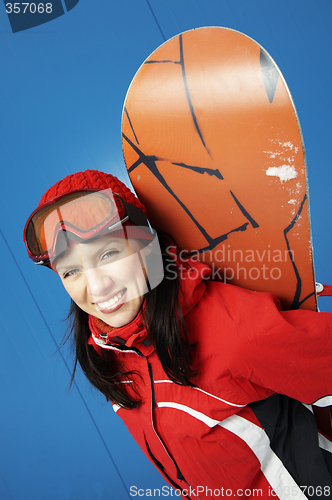 Image of young adult female snowboarder