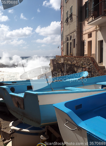 Image of Riomaggiore Cinque Terre old fishing boats on street with histor