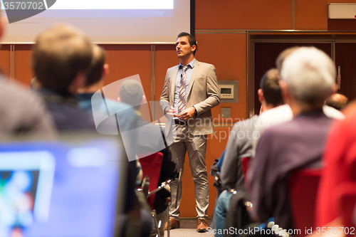 Image of Speaker Giving a Talk at Business Meeting.
