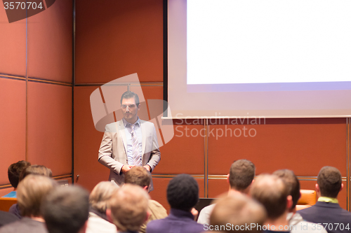 Image of Speaker Giving a Talk at Business Meeting.