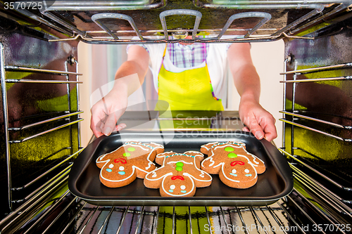 Image of Baking Gingerbread man in the oven