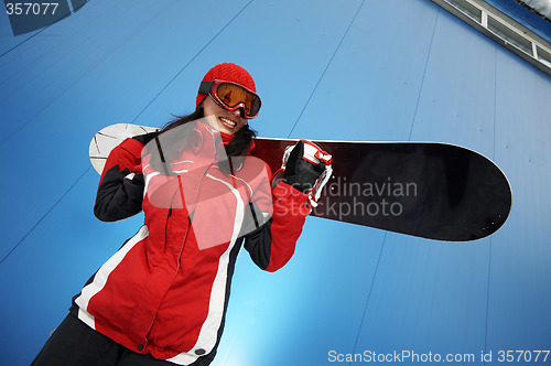 Image of young adult female snowboarder