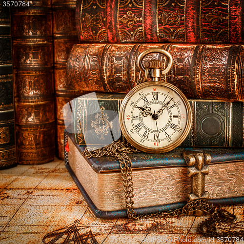 Image of Old Books and Vintage pocket watch