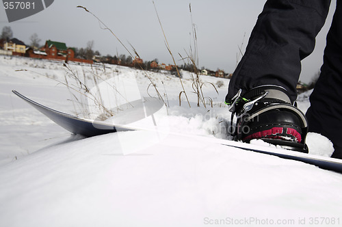 Image of young adult female snowboarder