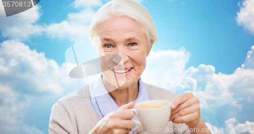 Image of happy senior woman with cup of coffee