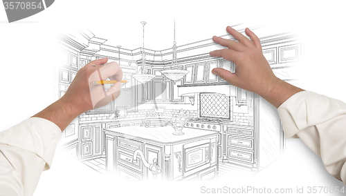 Image of Male Hands Sketching Beautiful Custom Kitchen