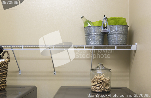 Image of Laundry Room with Buckets and Jar of Clothes Pins