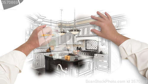 Image of Male Hands Sketching Custom Kitchen with Photo Showing Through