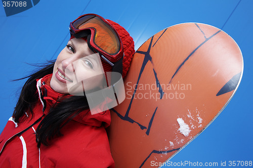 Image of young adult female snowboarder