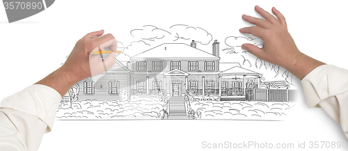 Image of Male Hands Sketching A Beautiful House