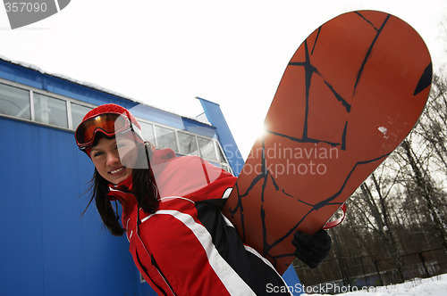 Image of young adult female snowboarder