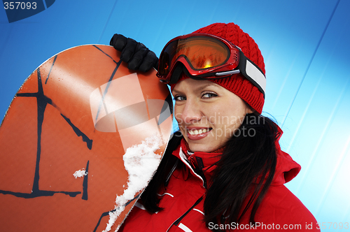 Image of young adult female snowboarder