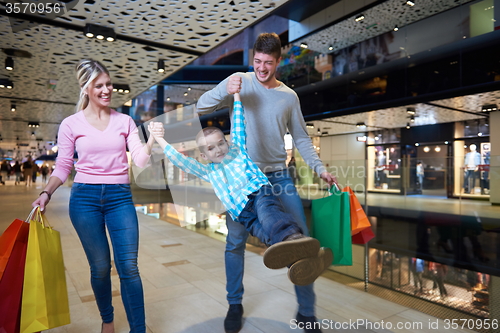 Image of young family with shopping bags