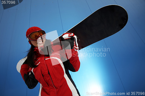 Image of young adult female snowboarder