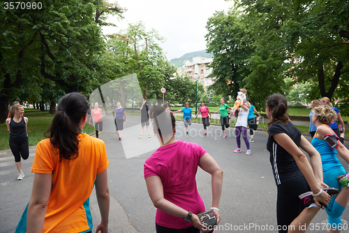 Image of jogging people group stretching