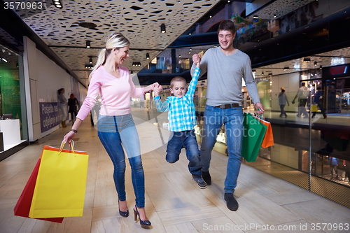 Image of young family with shopping bags