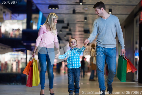 Image of young family with shopping bags